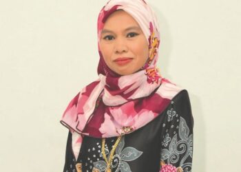 Norkamisah Mohd. Sam menghasilkan hampir 1,000 balang mangga jeruk sebulan.