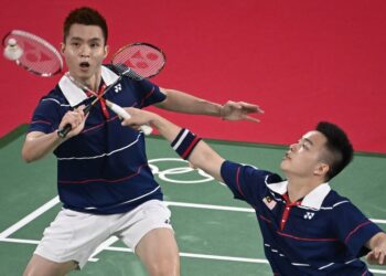 AKSI Aaron Chia (kanan) dan Soh Wooi Yik ketika menentang beregu Korea Selatan, Choi Sol-gyu-Seo Seung-jae.