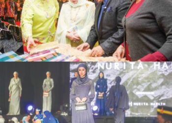 Raja Permaisuri Agong, Tunku Hajah Azizah Aminah Maimunah Iskandariah berkenan mendengar penerangan daripada Tengku Muhaini dan Raja Rezza Shah (dua dari kanan), ketika melawat ruang pameran pada Majlis Malam Amal Bakasa dan Bakat Festival Fesyen Islamik (IFF) 2022 di Wisma Perwira, baru-baru ini.