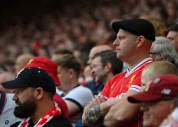 PENYOKONG Liverpool bermuram selepas pesaing terdekat, Manchester City menjuarai gelaran Liga Perdana Inggeris, kelmarin. - AFP