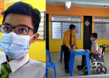 MUHAMMAD Nabil Najmi Zulkiflee yang berkerusi roda bersiap-sedia untuk menjawab peperiksaan bertulis kertas pertama Bahasa Melayu di SMK Bukit Katil, Melaka. - FOTO/DIYANATUL ATIQAH ZAKARYA