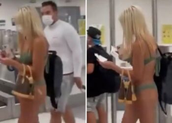 WANITA memakai bikini berwarna hijau dan pelitup muka, dilihat berjalan dengan penuh yakin di lapangan terbang. - INSTAGRAM