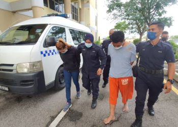 SEORANG operator kilang dan teman wanitanya ketika dihadapkan di Mahkamah Sesyen, Butterworth, Pulau Pinang hari ini atas pertuduhan cuba membunuh seorang anggota polis Khamis lalu