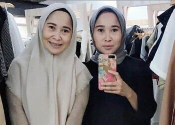 PASANGAN kembar yang dikenali sebagai Rihana dan Rihani kini jadi buruan polis berhubung kes penipuan jual iPhone. - AGENSI