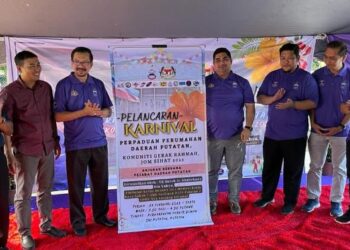 SHAHELMEY Yahya (empat dari kanan) semasa melancarkan Karnival Perpaduan Perumahan Daerah Putatan di Kota Kinabalu, Sabah hari ini.