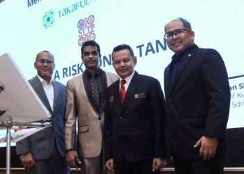 AMINUDDIN Awang pada majlis menandatangani MoU antara NUTP dan Takaful Am Malaysia di Putrajaya. - UTUSAN/FAISOL MUSTAFA