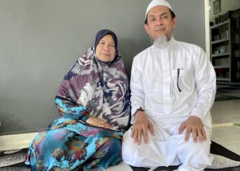 SYEIKH Muhd. Zainul Asri Mohd. Romli di samping isterinya, Mahani Mohamad.