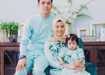 Muhammad Syafiq Ahmad serta isteri dan anak sulung mereka.