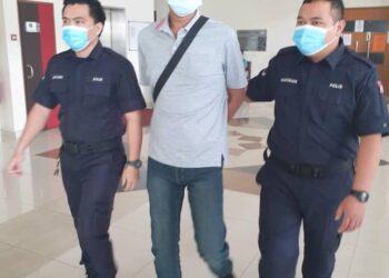 IZUANDY (tengah) dibawa ke Mahkamah Majistret, Klang, Selangor hari ini atas dakwaan menampar seorang juruwang wanita sedang hamil di sebuah pasar raya November lalu.