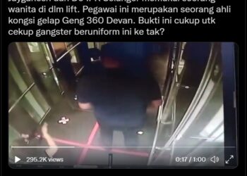 TANGKAP layar video seorang lelaki yang didakwa pegawai polis memukul seorang wanita dalam lif.