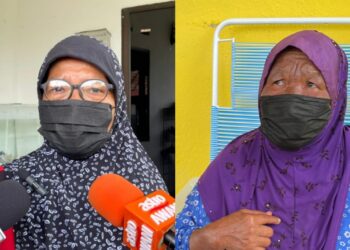COMEL Khudrat (kiri) dan Rahimah Kassim menceritakan mengenai masalah babi yang ‘menyerang’ kampung mereka di Tanjung Kling, Melaka.