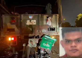 MOTOSIKAL Muhammad Faiszudin Rasip terperosok di bawah trak ATM dalam kejadian di Lebuh SPA, Melaka. - UTUSAN/DIYANATUL ATIQAH ZAKARYA