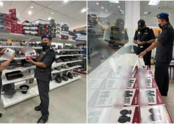 ANGGOTA penguat kuasa KPDNHEP Negeri Sembilan memeriksa premis di Taman Desa Cempaka, Nilai, Seremban kerana disyaki menjual aksesori kereta menggunakan jenama tiruan.
