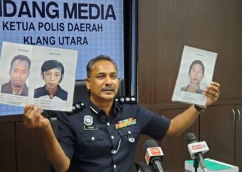 VIJAYA Rao Samachulu menunjukkan tiga gambar individu yang dikesan untuk membantu siasatan kes samun sebuah kilang di Klang, Selangor hari ini.