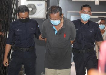 NG Chun Ming dituduh membunuh abang dan kakak iparnya dalam kejadian minggu lalu didakwa di Mahkamah Majistret Ipoh hari ini. - UTUSAN/MUHAMAD NAZREEN SYAH MUSTHAFA