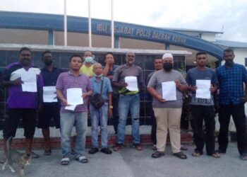 PENTERNAK dan individu yang membuat  laporan polis berhubung penipuan urus niaga lembu di IPD Kerian,  Bagan Serai semalam. - UTUSAN/WAT KAMAL ABAS