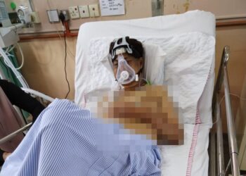 KEADAAN M. Daud Kilau yang dirawat kerana masalah paru-paru berair di Hospital Teluk Intan hari ini. - UTUSAN/IHSAN KELUARGA