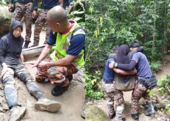ANGGOTA bomba menyelamatkan dua orang pendaki yang cedera di atas Gunung Datuk, Rembau petang tadi. GAMBAR/IHSAN BOMBA.