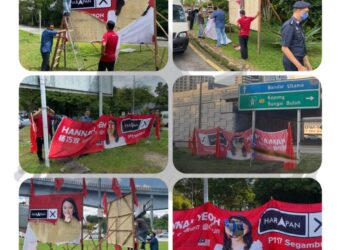 ANTARA bendera dan gegantung calon Parlimen Segambut yang dirosakkan.