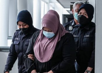 TERTUDUH mengaku tidak bersalah di Mahkamah Majistret, Ayer Keroh, Melaka atas pertuduhan menyebabkan kecederaan ke atas bayi perempuan berusia lapan bulan. - UTUSAN/SYAFEEQ AHMAD
