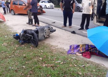LOKASI kemalangan yang meragut nyawa dua beradik di kilometer (km) 37.5 Jalan Kota Bharu-Kuala Terengganu, Pasir Puteh, Kelantan di sini hari ini.-UTUSAN/IHSAN PEMBACA