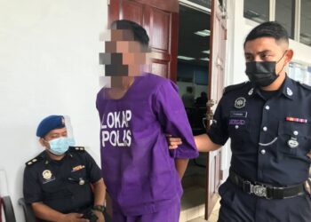 LELAKI yang dituduh melakukan amang seksual terhadap anak tiri dan mencederakan isterinya ketika didakwa di Mahkamah Sesyen Taiping hari ini. - UTUSAN