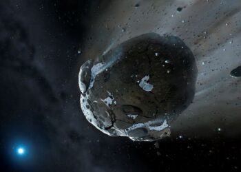 GAMBARAN pelukis dari University of Warwick dan University of Cambridge mengenai asteroid berbatu hancur akibat tekanan graviti kuat.-AFP