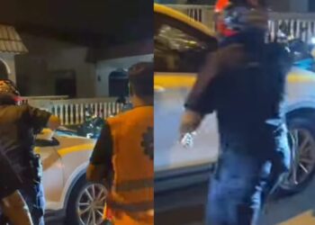 TANGKAP layar video yang tular di Facebook menunjukkan anggota polis yang dibantu oleh orang awam cuba menahan seorang pemandu kereta yang cuba melarikan diri selepas melanggar lampu merah dan seorang anggota Rela di Nibong Tebal, Pulau Pinang malam kelmarin.