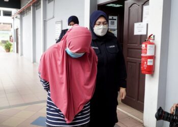 NURSAHIDAH Amran didakwa di Mahkamah Sesyen Ipoh hari ini atas tuduhan cubaan membunuh bayi lelaki berusia tujuh bulan  minggu lalu. - UTUSAN/ZULFACHRI ZULKIFLI