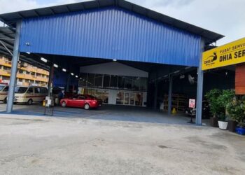 PUSAT servis kenderaan Dhia di Kamunting, Taiping, Perak beroperasi sejak 10 tahun lalu. - UTUSAN/WAT KAMAL ABAS