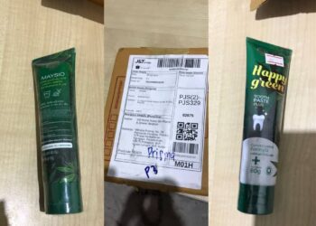 POLIS merampas satu tiub ubat gigi  berpenutup berwarna hijau dan putih bercorak daun ganja tertera tulisan ‘Happy Green’ Dalam serbuan di sebuah hab kurier di Pulau Meranti, Puchong, Selangor. - GAMBAR IPD SEPANG
