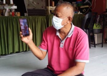 SOPA Wazi menunjukkan gambar Nor Fahizatul Syahira yang ditemukan mati di tepi Sungai Jebong, Kuala Sepetang, Taiping, Perak, Oktober lalu. - UTUSAN/OTHMAN YAHAYA