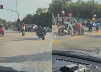 TANGKAP layar video tular sejak semalam memaparkan beberapa individu bertindak sebagai marsyal yang memberhentikan kenderaan awam bagi memberi laluan kepada sekumpulan penunggang motosikal berkuasa tinggi di sebuah lampu isyarat di Port Dickson.