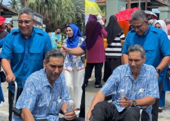 MEGAT ZULKARNAIN Omardin membantu adiknya, Megat Khairul Anuar Omardin mengundi di SK Taman Seri Gombak 2, Selangor.