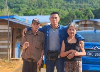 EDRIN Baintim (tengah) bersama ibu dan bapanya di Tongod, Sandakan, Sabah.