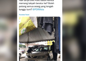 TANGKAP layar sebuah MPV polis yang didakwa memotong barisan untuk mencuci kenderaan di Pantai Dalam, Kuala Lumpur, baru-baru ini.