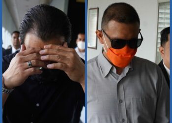 MOHD. Hussein Mohd. Nasir (kemeja hitam) dan Mohd. Rasyidi Mohd. Said hadir di Mahkamah Sesyen Kuala Lumpur bagi menghadapi pertuduhan rasuah. -UTUSAN/AMIR KHALID