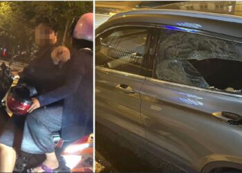 TANGKAP layar video menunjukkan penunggang motosikal memecahkan cermin kereta selepas dibunyikan hon di Cheras, kelmarin.