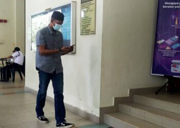 RUZAINI A. Halim yang dituduh merasuah pegawai polis hadir ke Mahkamah Sesyen Alor Setar, hari ini. - UTUSAN/MOHD. RAFIE AZIMI