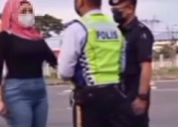 TANGKAP layar video memaparkan seorang wanita menengking anggota trafik di SJR Jalan Kepayan.